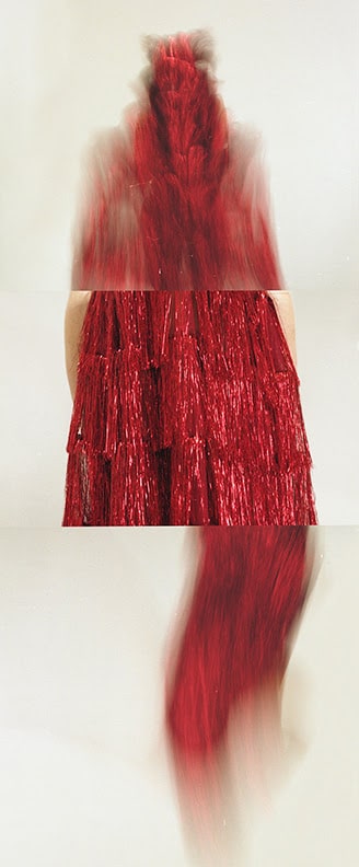 Partly blurred vertical image of red garment