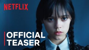 Text "official teaser" over still of Wednesday Addams glaring