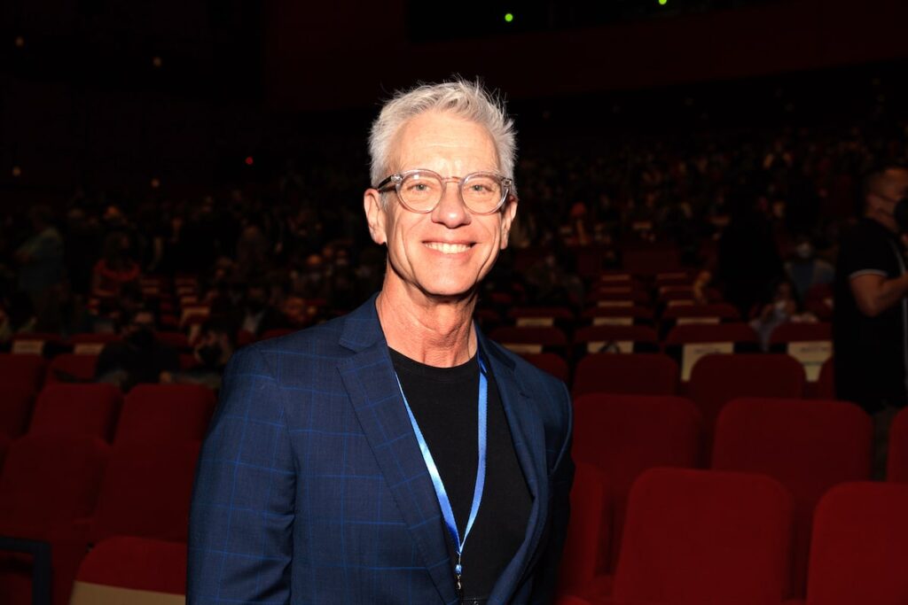 CalArts alum and guest of honor Chris Sanders wears a black t-shirt and blue jacket to the 2023 Producers' Show.