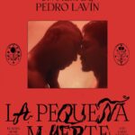 Red film poster with text 'Un Film de Pedro Lavin - La Pequeña Muerte' and still of two lead actors resting foreheads