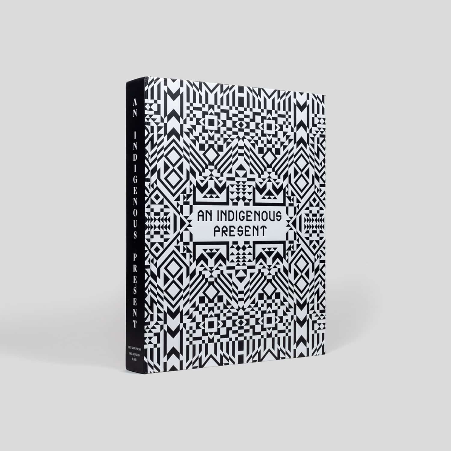 Book with elaborate black and white patterned cover and title 'An Indigenous Present'