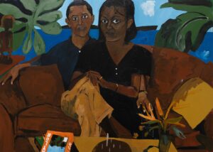 Two Black people sitting on a couch looking directly at the viewer.
