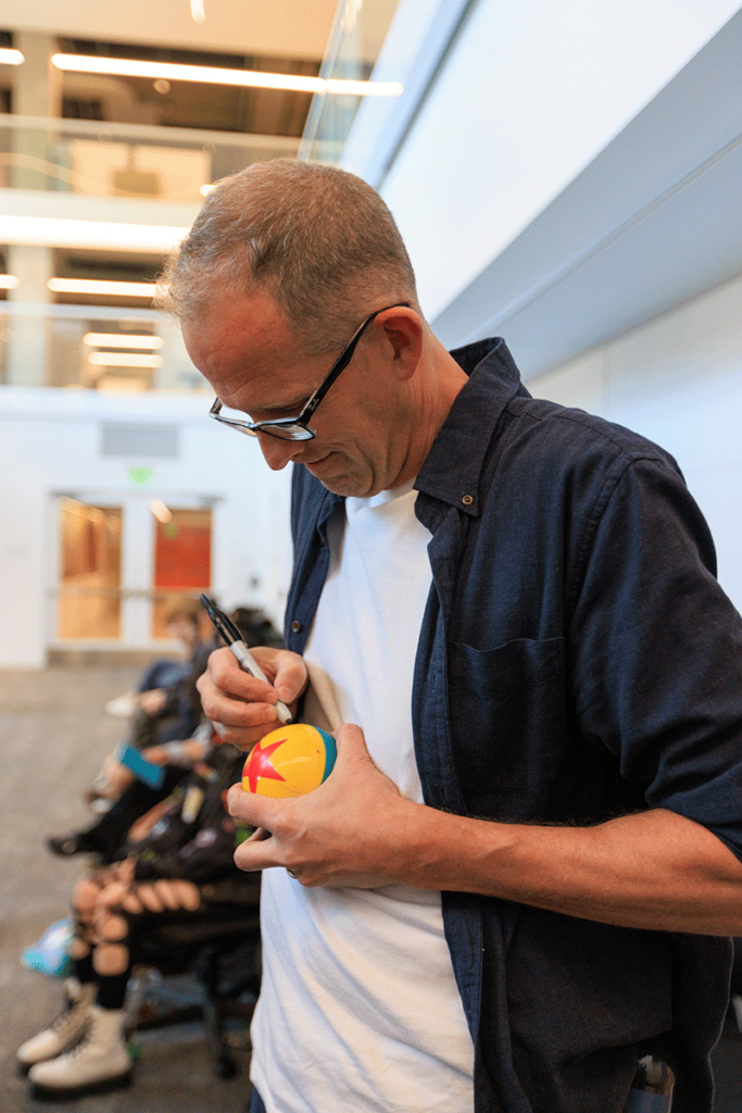 Docter signs a Pixar ball.