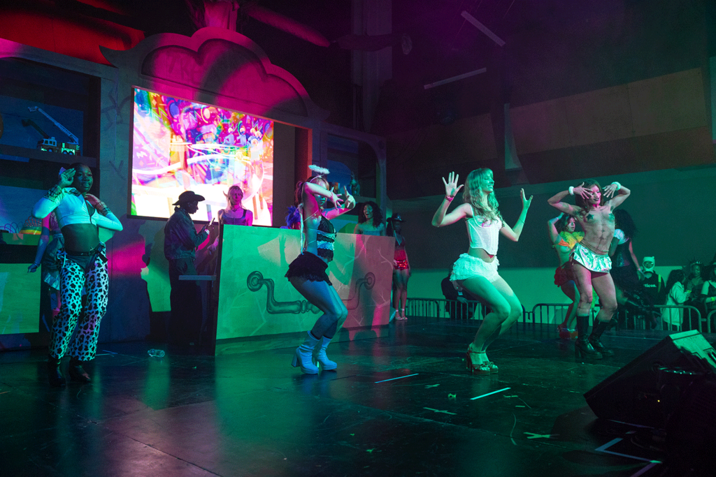 Dancers synchronizing poses on the Main Gallery stage