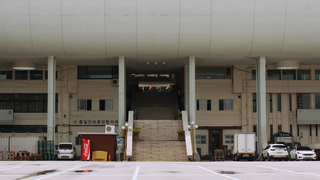 Wide shot of a large staircase flanked by two building complexes.