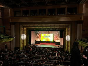 Balcony view of Royce Hall with Annie Awards logo splashed on large screen on stage