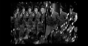 Multiple reflections of a man in a suit and bowler hat holding a bottle in a mirrored room.