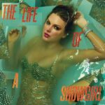 Taylor Swift in water in a showgirl outfit.