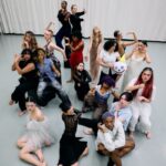 Dance students pose in a studio