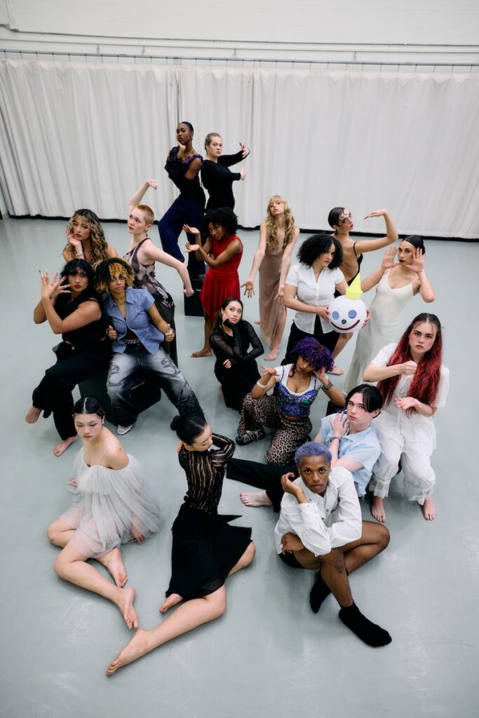 Dance students pose in a studio