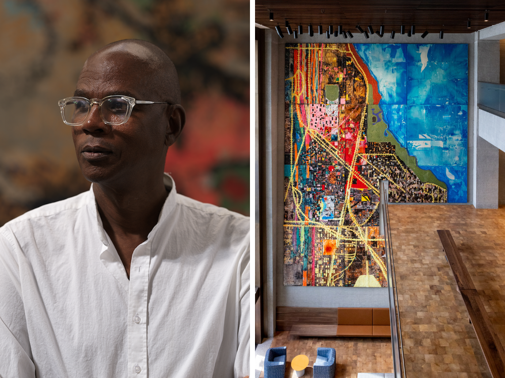A person with glasses and a white shirt on the left; abstract city painting on a large wall in a modern atrium on the right.