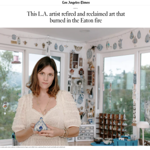 Artist Chelsea Byers stands in her studio, holding a blue and white ceramic piece, surrounded by various art pieces and decor.
