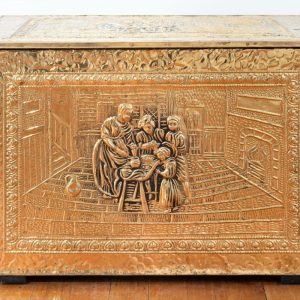Picture of a gold box with a sculpted relief of a family on the front.